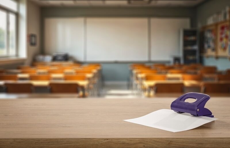 classroom supplies with empty chair