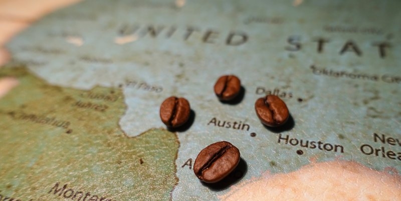 Coffee beans placed on a map of the United States.