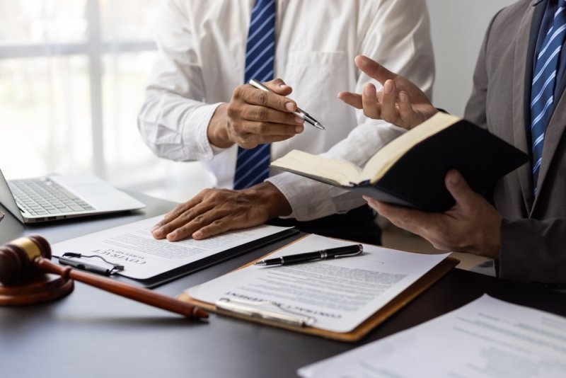 Commercial litigation lawyers reviewing case documents