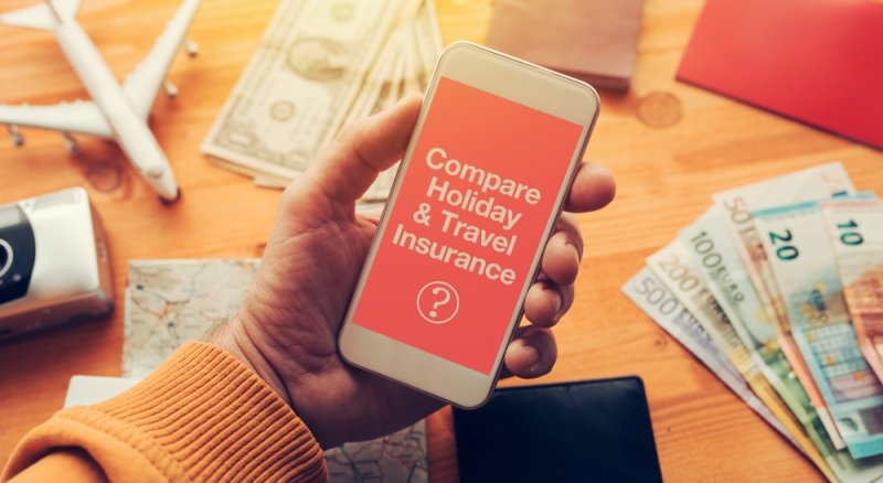 Man holding smartphone with mock up app screen related to holiday vacation journey trip.