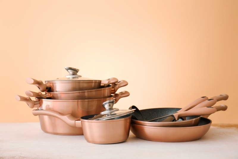 Set of copper utensils on table