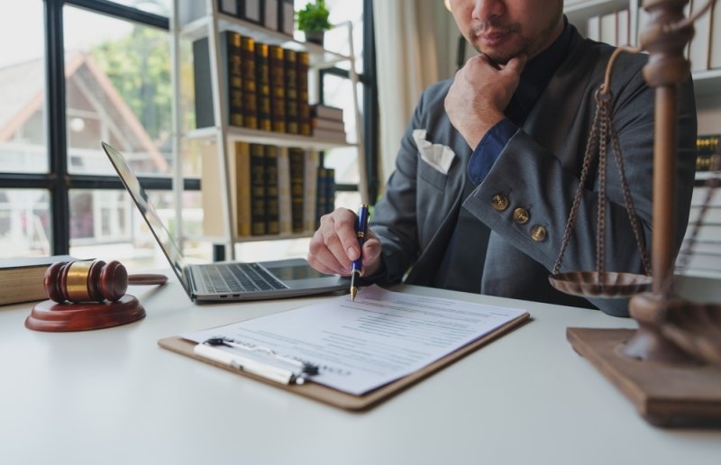 Corporate lawyer reviewing business legal documents
