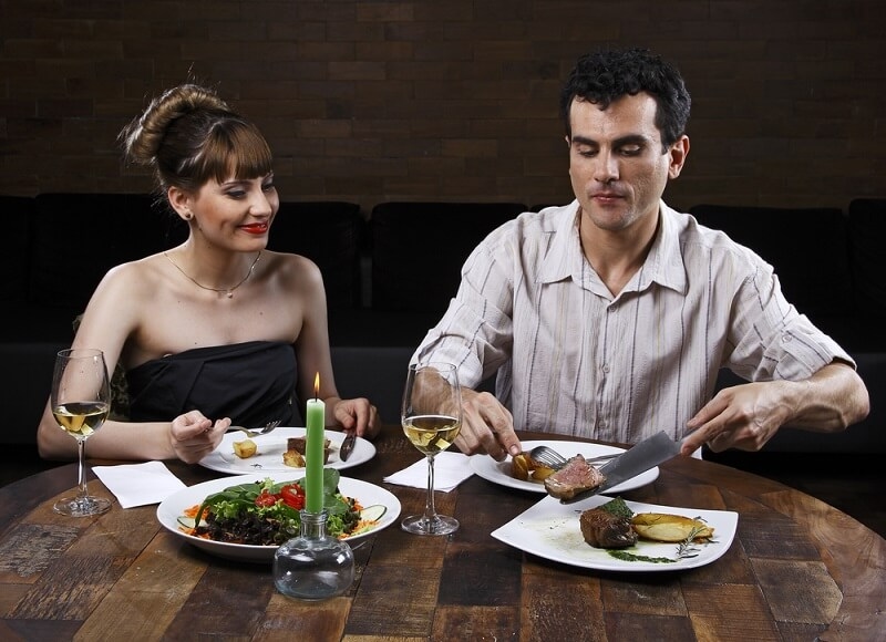 couple eating dinner at romantic date