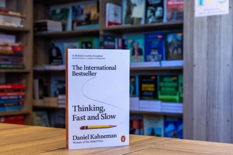 Close-up of Daniel Kahneman's Thinking, Fast and Slow book in the bookstore. 