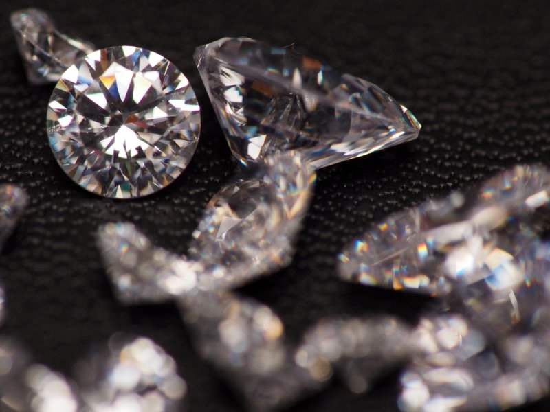 Close-up comparison of cushion cut and princess cut diamonds
