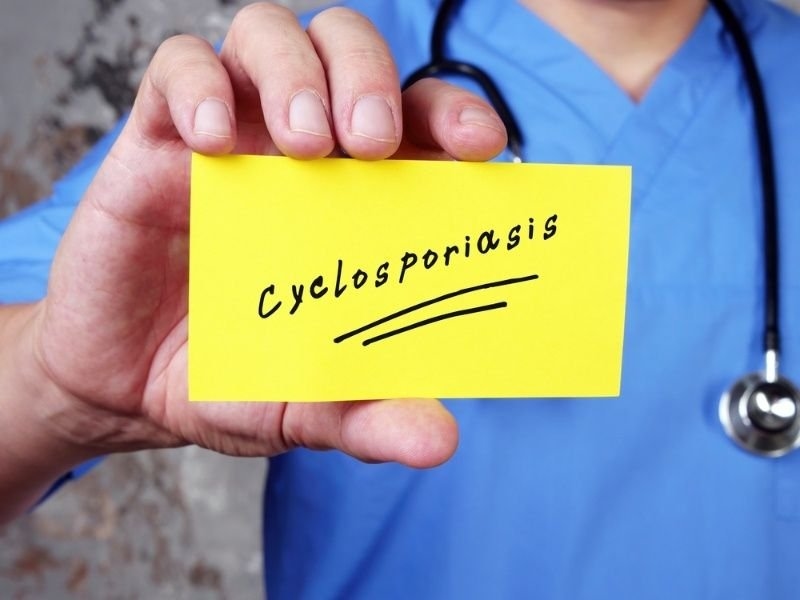 Healthcare professional holding a card labeled 