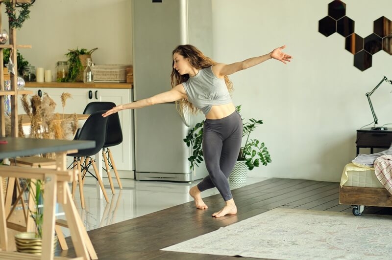woman dancing and practicing at home