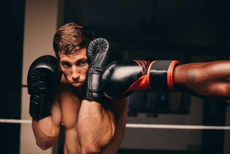 Boxer defending a punch on his face