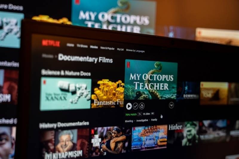Television displaying Netflix documentary film selections including ‘My Octopus Teacher.’