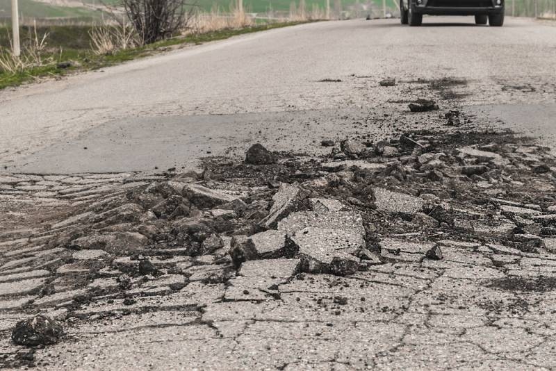 car on road moving during an earthquake