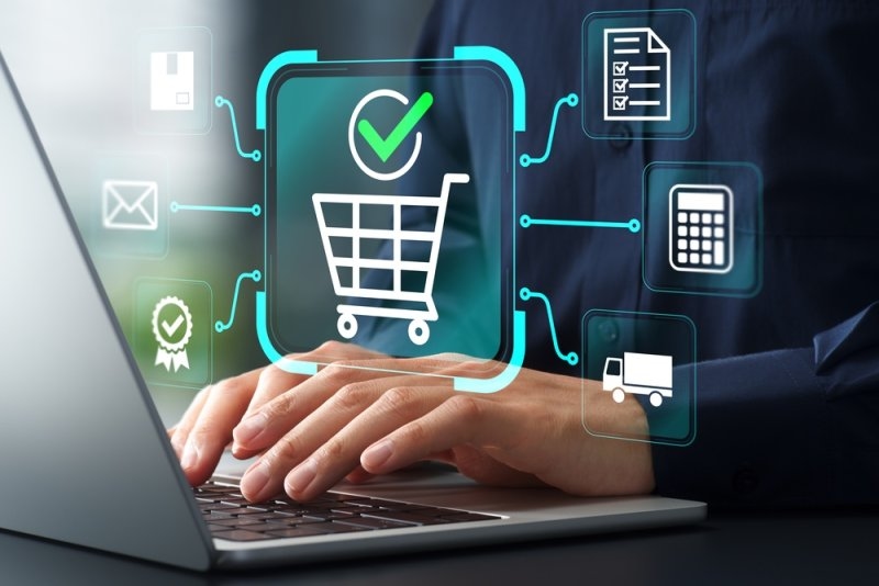E commerce icon hologram on top of a laptop
