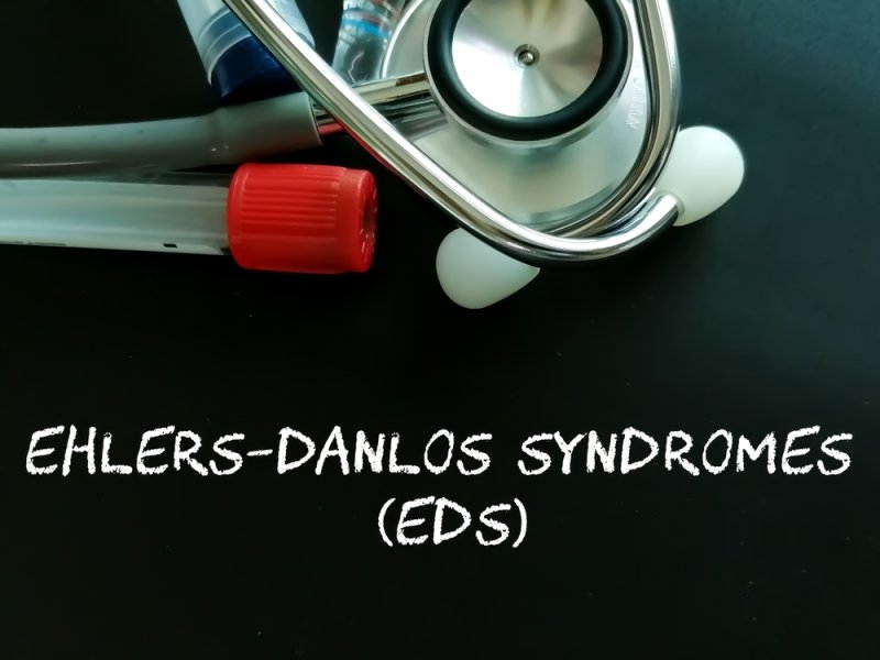 Medical equipment and a stethoscope beside text about Ehlers-Danlos syndrome (EDS).