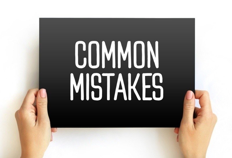 "Common Mistakes" written on a black card.