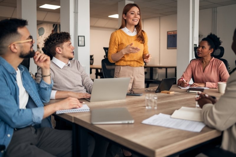 Employees participating in workplace engagement strategies and team collaboration