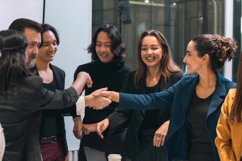 Business team recognizing an employee for good performance
