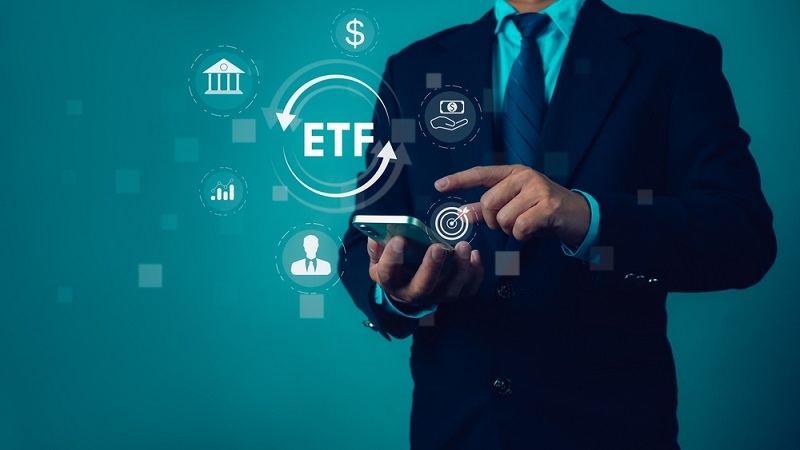 Businessman holding virtual interface panel of digital device showing Volatility ETF