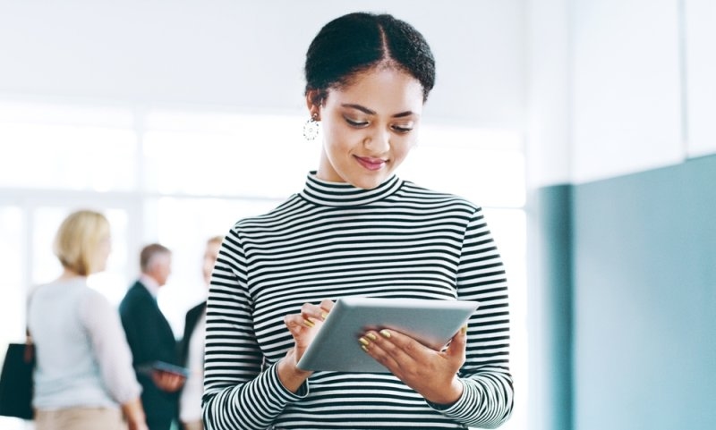 woman using her tablet for event registration software