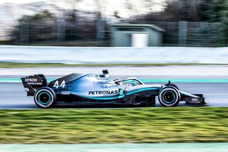 Mercedes Formula 1 race car speeding around a professional circuit during testing or competition.