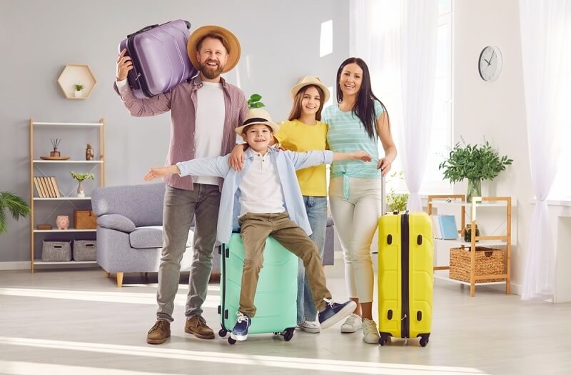 family ready for vacation trip with all luggage