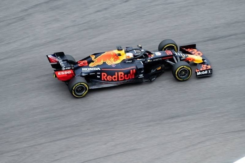 Red Bull Racing Formula 1 car speeding around a racetrack during a competitive motorsport event.