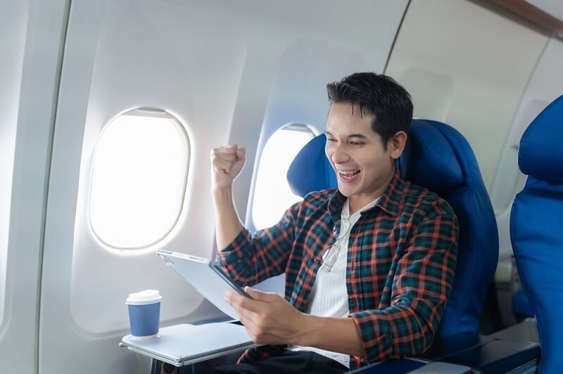 man seems happy after getting flight discount