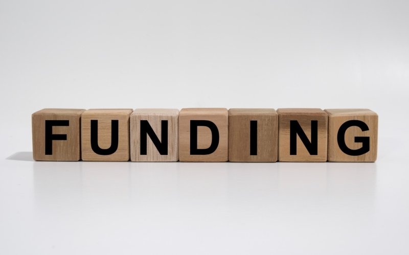 Text Funding words printed on wooden blocks
