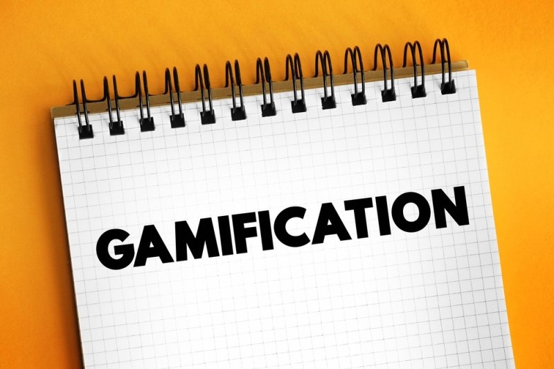 Gamification text on spiral notepad concept