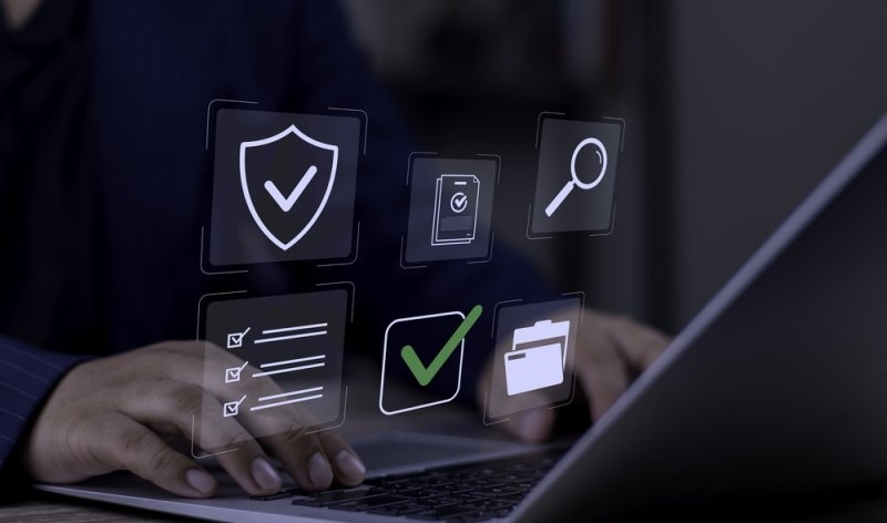 Digital compliance checklist with security and verification symbols representing data privacy auditing.