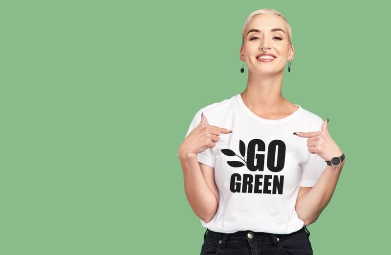 women wearing t-shirt with text go green promoting green fashion