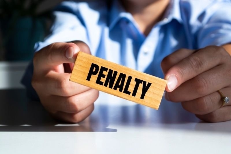 Person holding a wooden block labeled 