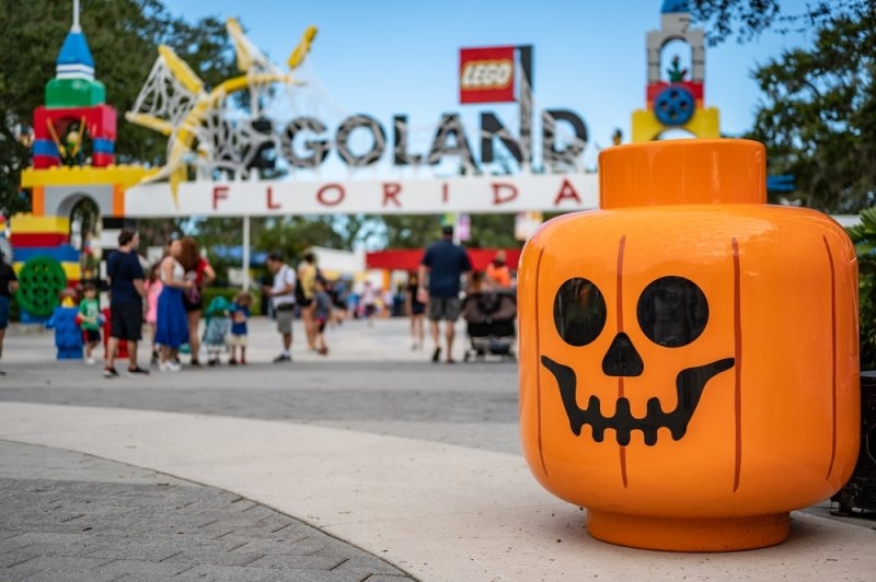 EGOland Florida entrance decorated for Halloween, with a large orange pumpkin-shaped decoration in the foreground.