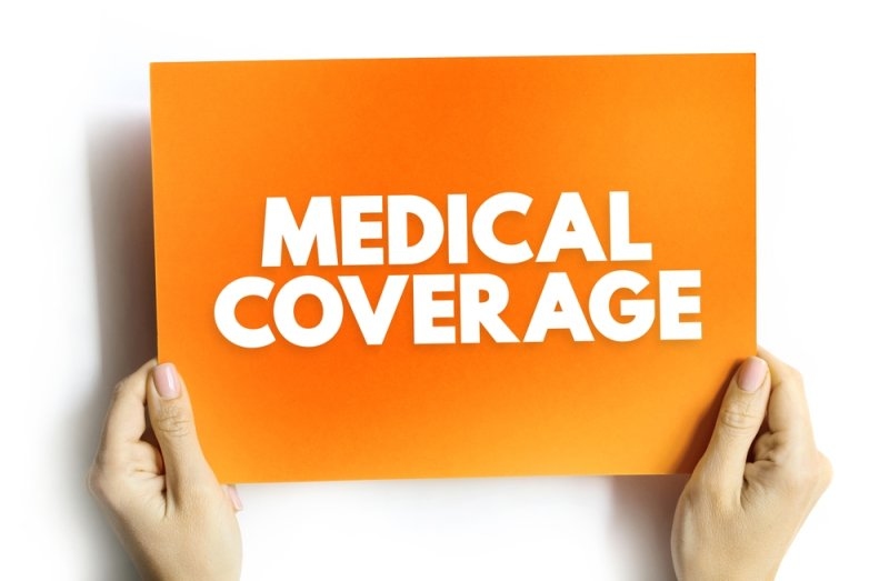 Text Healthcare Coverage on orange paper