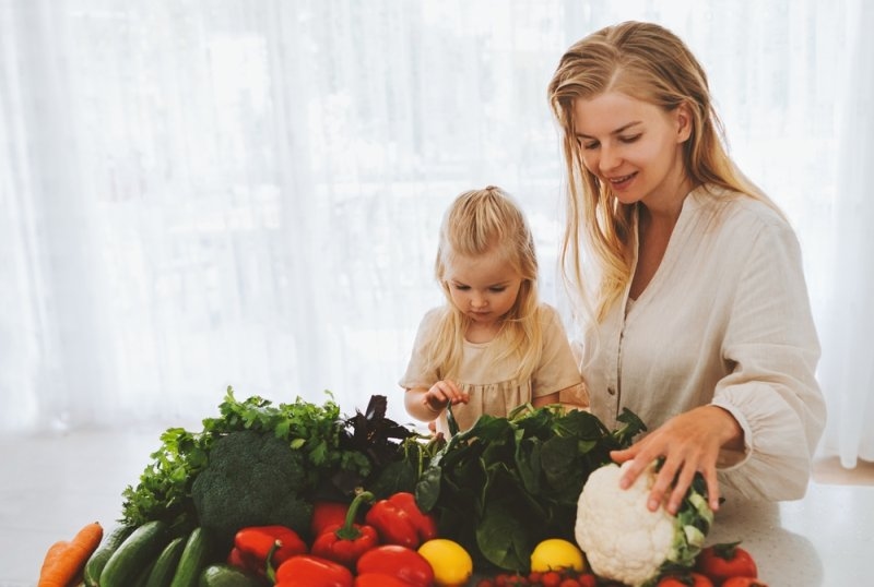 mother and daughter child cooking healthy food