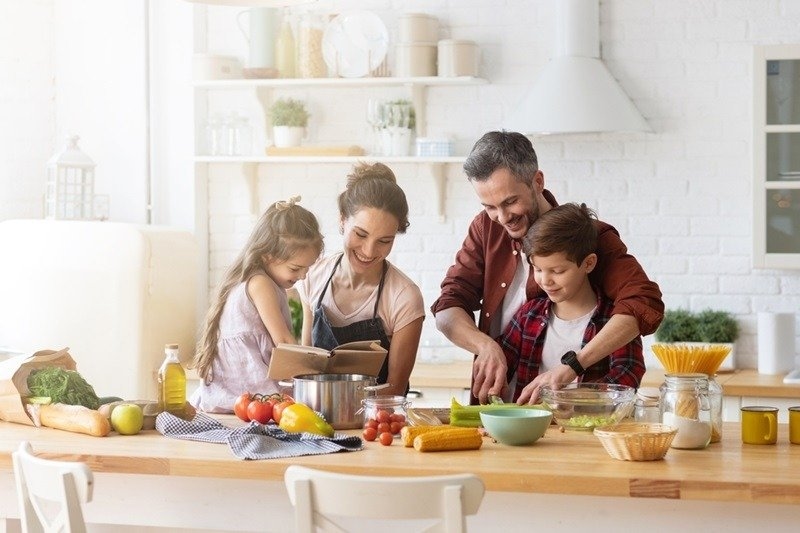 Happy family cooking together on kitchen