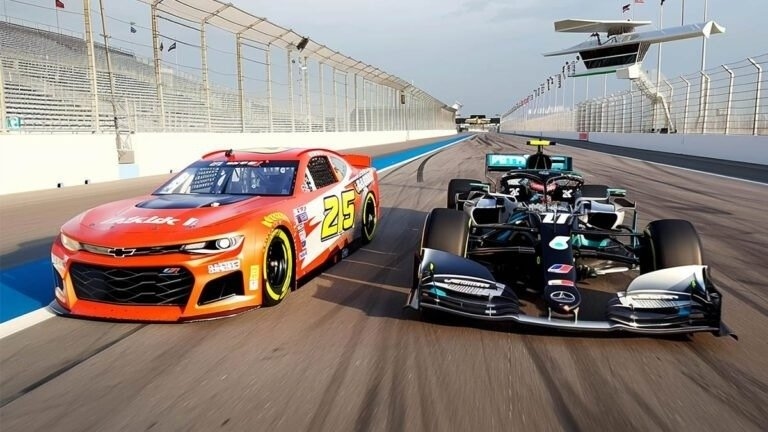 A stock car and an open-wheel race car drive side by side on a racetrack.