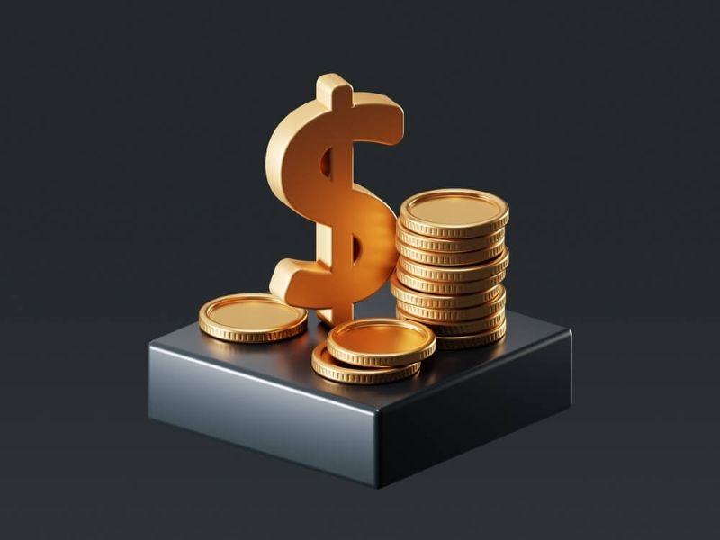 Dollar symbol and gold coin on a black block isolated