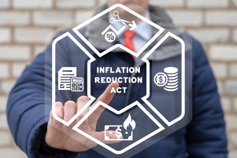 Man using virtual touch screen INFLATION REDUCTION ACT.