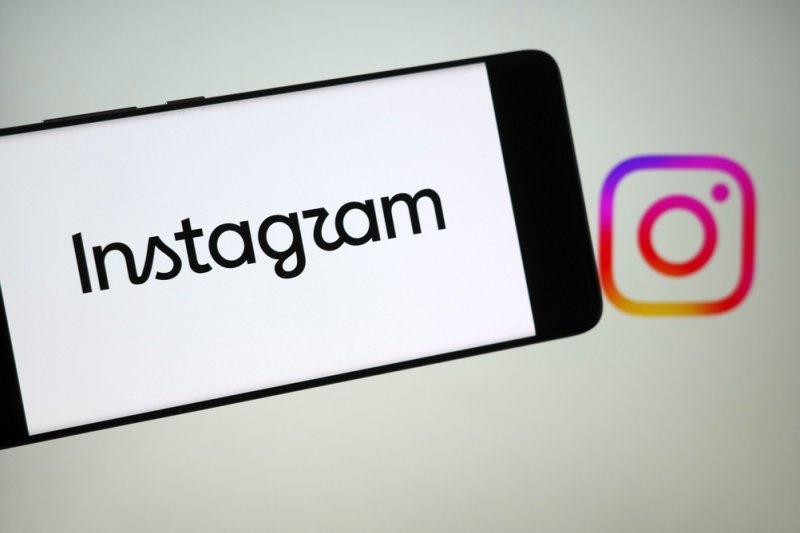 Instagram's official new wordmark displayed on a smartphone screen.
