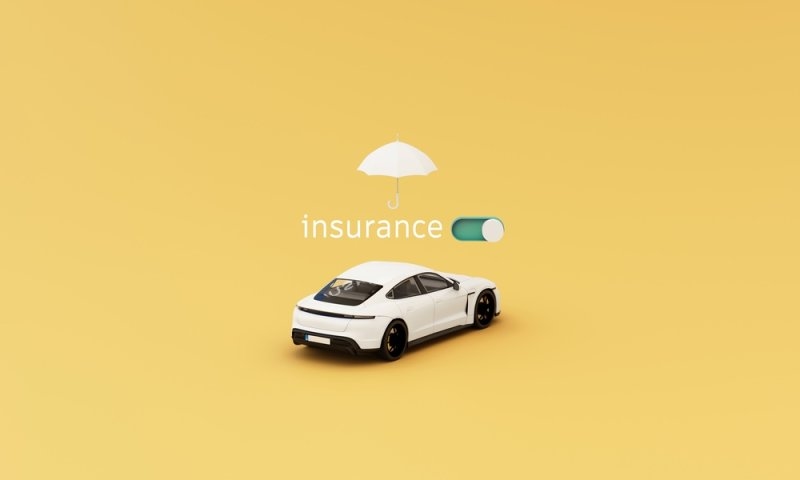 Car insurance concept with car and an umbrella on top 