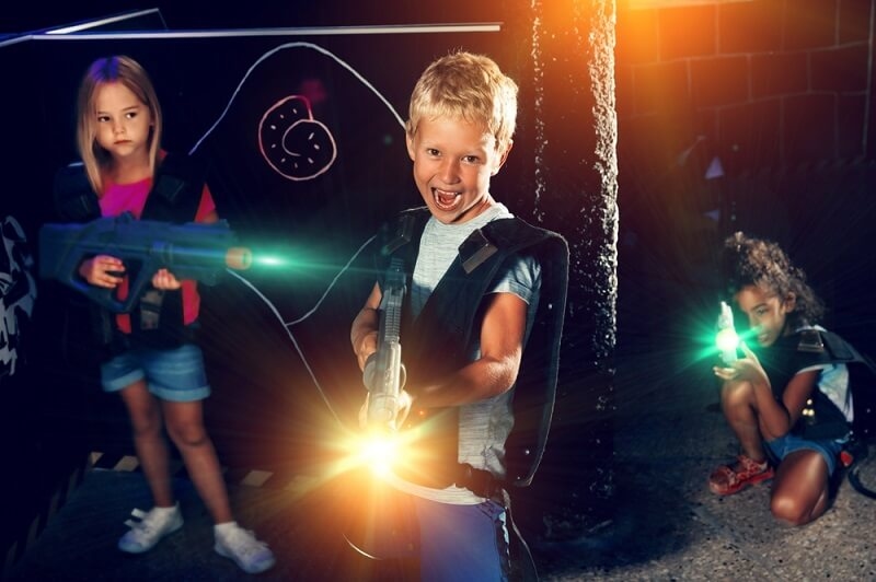 kids playing tag game inside house