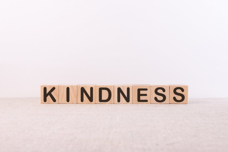 Text words kindness on wooden blocks