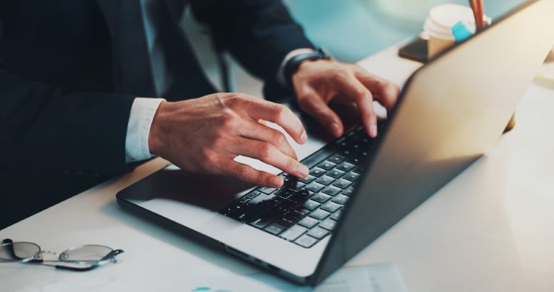 man working on laptop in corporation