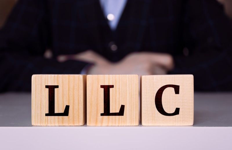 LLC text on wooden blocks side by side
