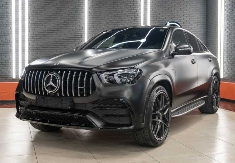 A black Mercedes-Benz SUV displayed indoors.