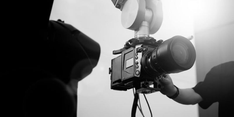 Video or film production with high tech robotic arm equipped with a professional cinema camera