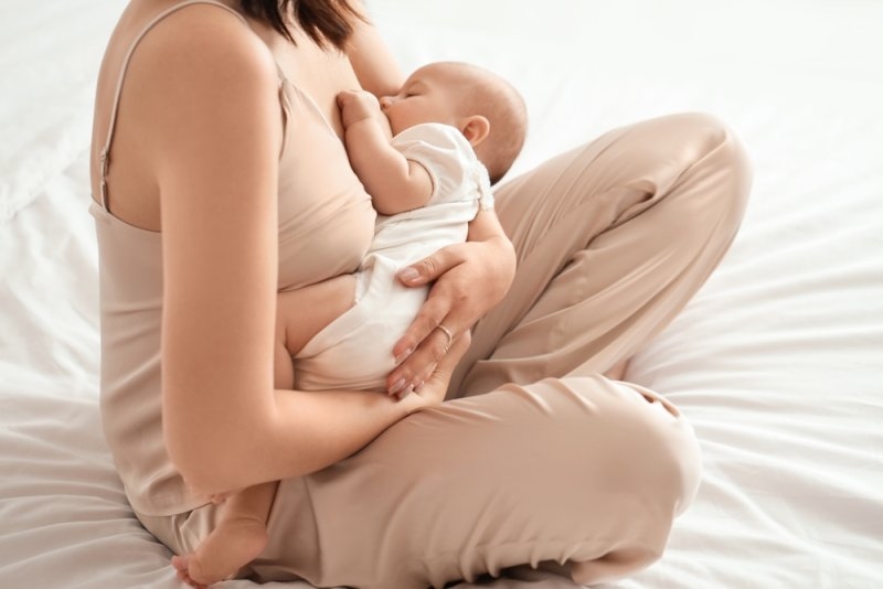 woman breastfeeding her baby