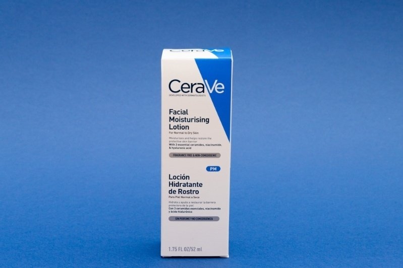 Box of CeraVe Facial Moisturising Lotion displayed against a blue background.