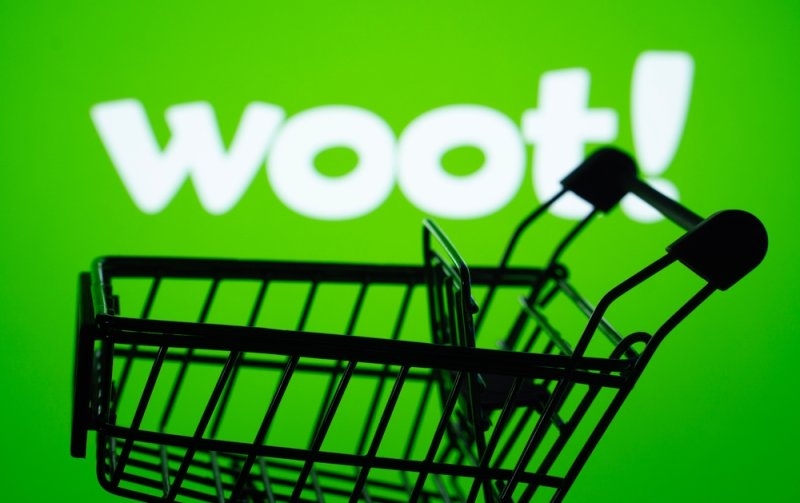 Silhouette of a shopping cart in front of the Woot logo.