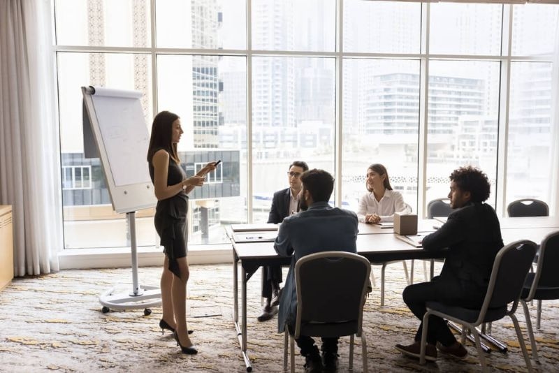 A working woman presenting a pitch to investors