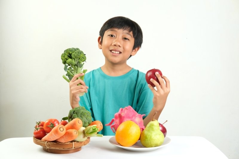 Child with healthy plant foods